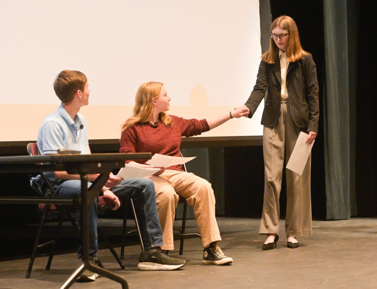 Ben Zinn, Gianna Lish, and Rosie Risch performing a scene from Risch's play.