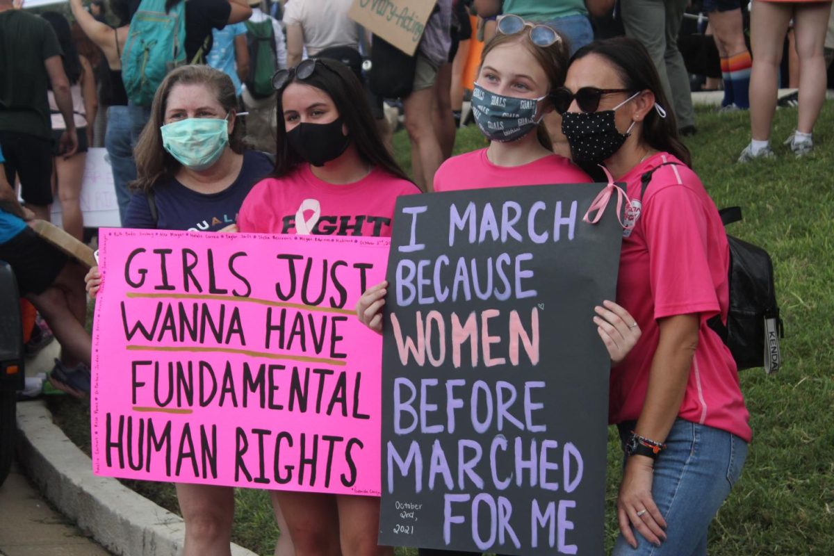 MARCHING FOR THEIR RIGHTS: People attending the march advocate for gender equality and social change.